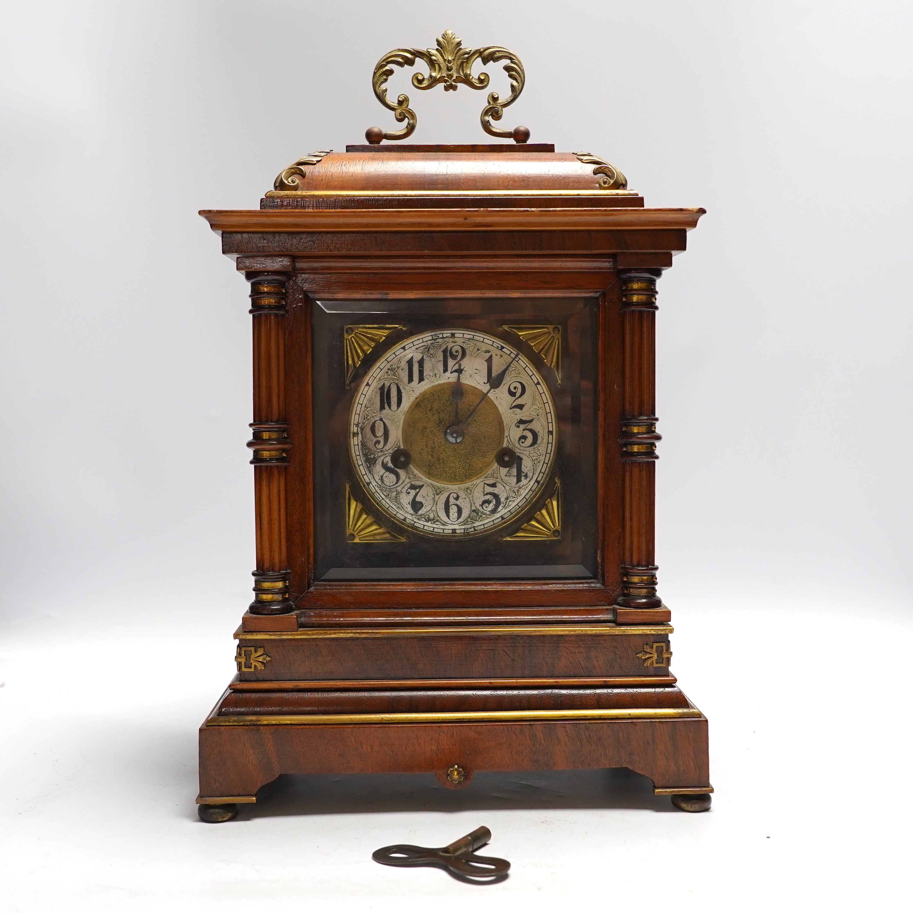 A Black Forest mantel clock with an HAC, Wurttemberg movement, striking on a coiled gong, 35cm high together with an early 20th century inlaid mahogany mantel clock